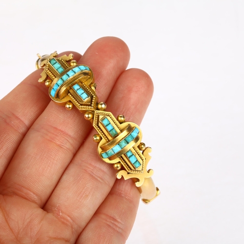 1116 - A Victorian 15ct gold Etruscan Revival turquoise hinged bangle, circa 1880, the central double cross... 