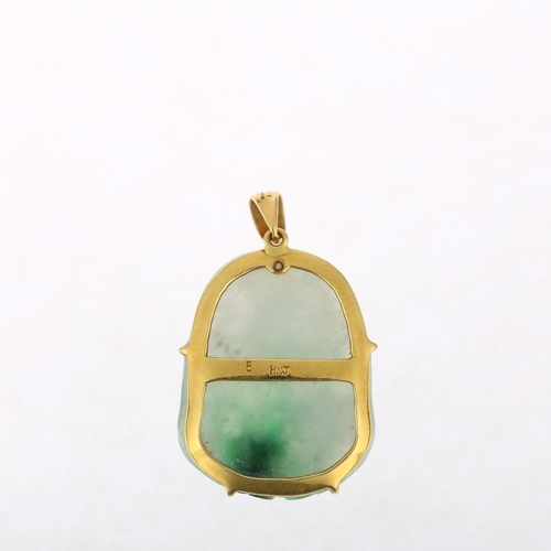 1121 - A Chinese 18ct gold jade Buddha pendant, maker HKJ, 30.9mm, 5.2g