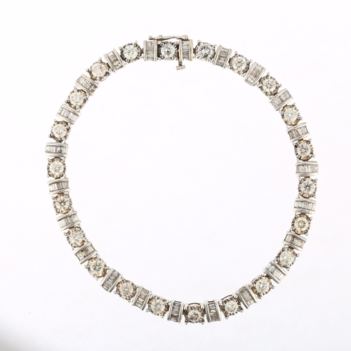 1126 - An American 10k white gold diamond tennis line bracelet, set with modern round brilliant and baguett... 