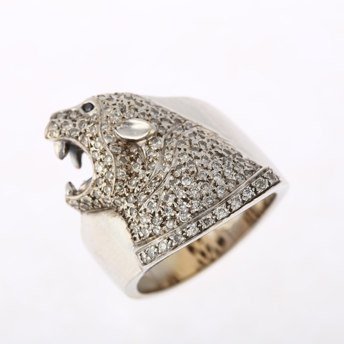 1139 - A large 18ct white gold diamond panther head ring, pave set with round brilliant-cut diamonds, setti... 