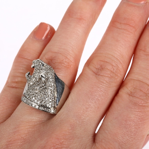 1139 - A large 18ct white gold diamond panther head ring, pave set with round brilliant-cut diamonds, setti... 