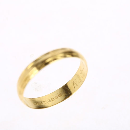 1187 - A late 20th century 18ct gold wedding band ring, maker MS&S, London 1982, engraved cross decoration,... 