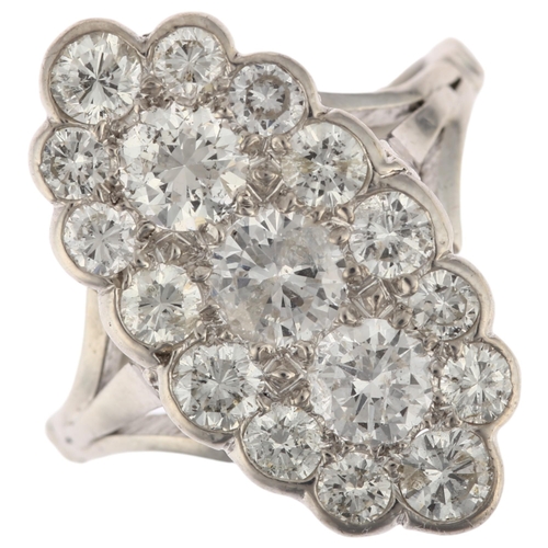 1196 - A large 18ct white gold diamond triple cluster cocktail ring, pave set with modern round brilliant-c... 