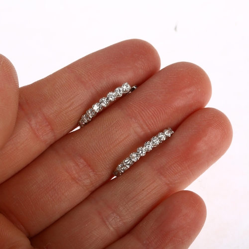 1197 - A pair of 18ct white gold diamond hoop earrings, claw set with modern round brilliant-cut diamonds a... 