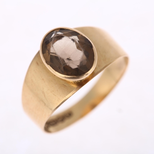 1199 - ALPO TAMMI - a Finnish 14ct gold smoky quartz dress ring, circa 1961, rub-over set with oval mixed-c... 