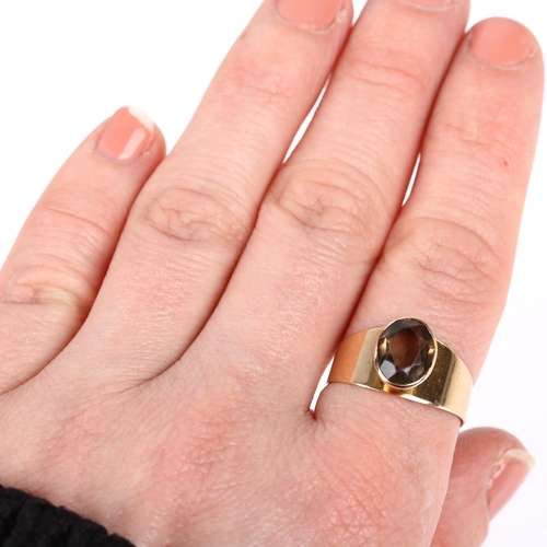 1199 - ALPO TAMMI - a Finnish 14ct gold smoky quartz dress ring, circa 1961, rub-over set with oval mixed-c... 