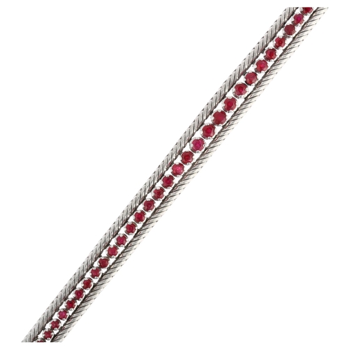 1200 - A mid-20th century 18ct white gold graduated ruby line bracelet, import London 1966, claw set with r... 