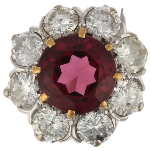 1201 - A fine pyrope garnet and diamond flowerhead cluster ring, claw set with 2ct round-cut garnet surroun... 