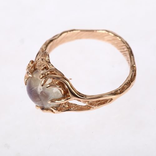 1204 - A modern moonstone naturalistic ring, realistically designed as branches holding a round cabochon mo... 