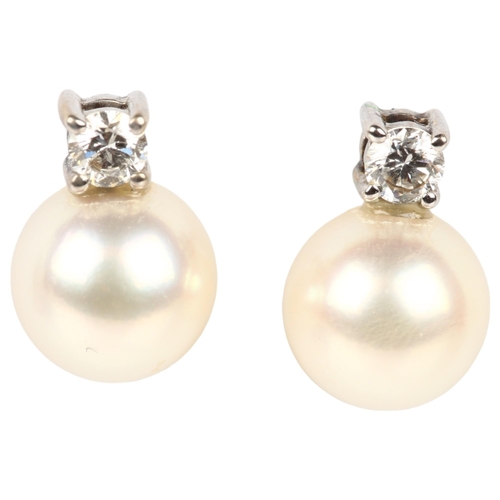 1207 - A pair of 18ct white gold whole pearl and diamond earrings, each claw set with 0.07ct modern round b... 