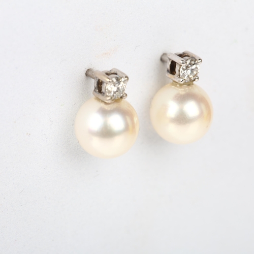 1207 - A pair of 18ct white gold whole pearl and diamond earrings, each claw set with 0.07ct modern round b... 