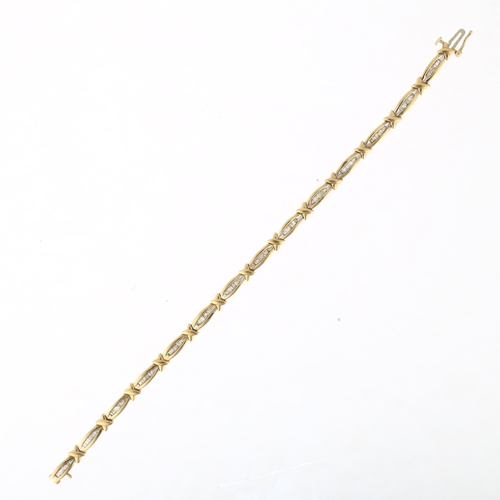 1209 - A 9ct gold diamond line bracelet, set with tapered baguette-cut diamonds, total diamond content appr... 