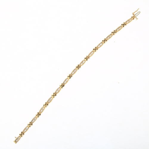 1209 - A 9ct gold diamond line bracelet, set with tapered baguette-cut diamonds, total diamond content appr... 