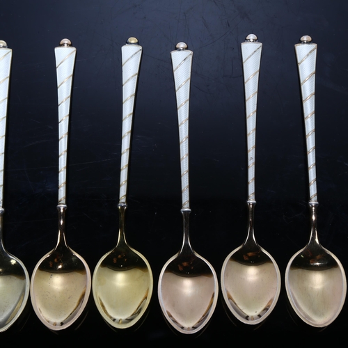 1667 - EGON LAURIDSEN - a set of Danish vermeil sterling silver and white enamel coffee spoons, 9.5cm