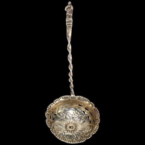 1673 - A Victorian silver Apostle tea strainer/sifter spoon, Charles Edwards, London 1880, 16cm, 0.8oz