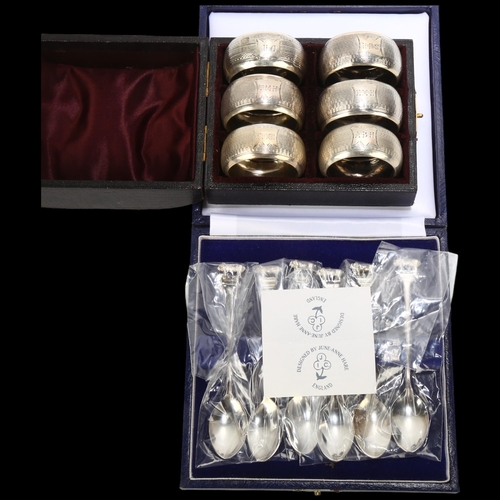 1693 - A cased set of 6 Victorian silver napkin rings, Nathan & Hayes, Birmingham 1893, 4.5cm, 2.4oz, and a... 