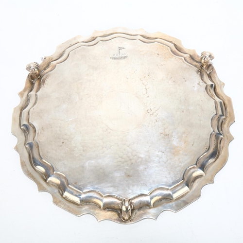 1709 - A George V circular silver salver, Walker & Hall, Sheffield 1934, scalloped rim with planished decor... 