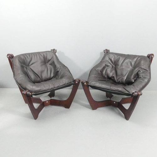A pair of contemporary laminate and brown leather upholstered Luna tub chairs in the manner of Odd Knutsen.
