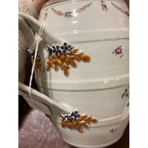 201 - A large Chinese export porcelain barrel-shaped jug, with cross over handles and gilded armorial cres... 