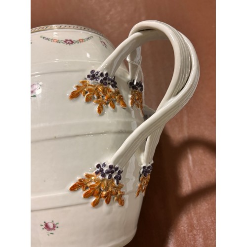 201 - A large Chinese export porcelain barrel-shaped jug, with cross over handles and gilded armorial cres... 