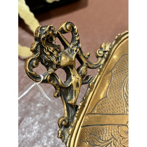 16 - A 19th century French solid cast bronze armorial dish, with relief cast heraldic lion design, cast l... 