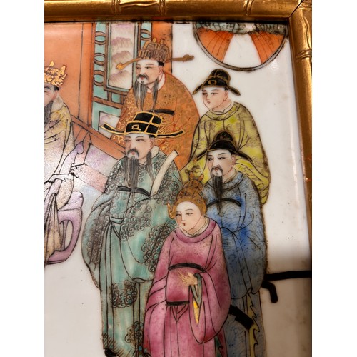 242 - A Chinese white glaze porcelain plaque, with painted and gilded court figures, gilded simulated bamb... 