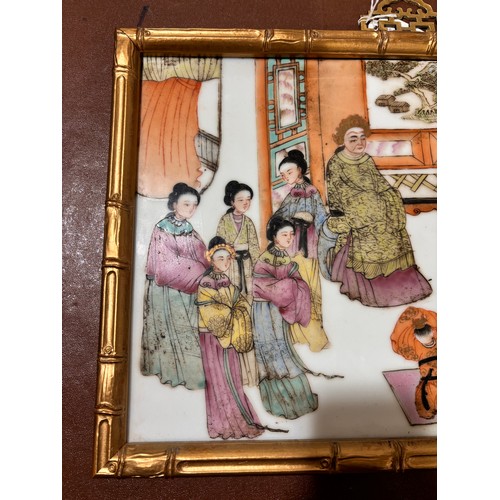 242 - A Chinese white glaze porcelain plaque, with painted and gilded court figures, gilded simulated bamb... 