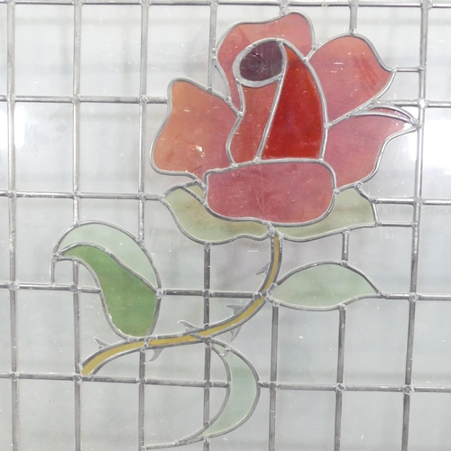 2684 - A leadlight glazed window with rose design. 114x113cm.