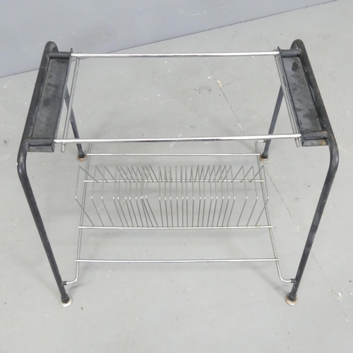 2688 - A mid-century magazine rack in tubular metal frame. 57x44x44cm.