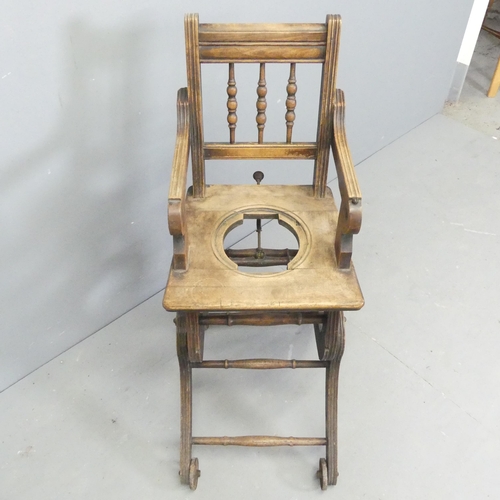 2689 - An early 20th century oak metamorphic high chair. Dimensions as chair 37x94x58cm.