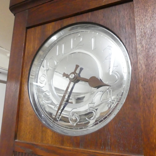 2692 - An Art Deco oak-cased longcase clock, with two weights and pendulum. 47x210x27cm.