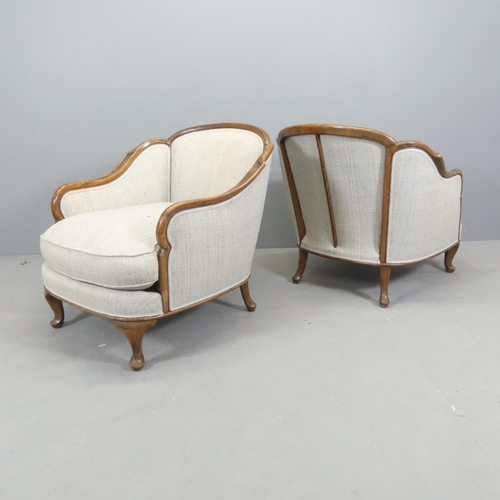 2691 - A pair of continental Art Deco style cloud back oak and upholstered lounge chairs