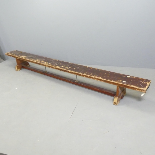 2695 - A vintage stained pine school gymnasium bench. 267x29x25cm