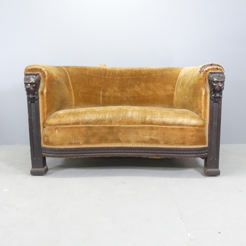 2697 - A 19th century oak and upholstered two-seater sofa, with carved lion mask decoration. Overall 140x80... 