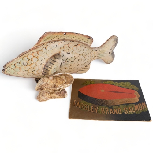 678 - A Vintage painted metal fish sculpture, L46cm, a box made from shells, and a printed card advertisin... 