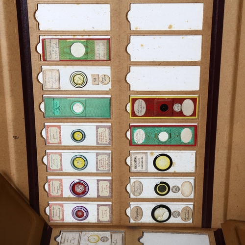 27 - A group of 16 antique microscope specimen folders, containing an extensive collection of slides cura... 