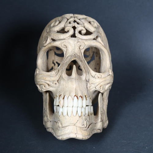 133 - Curiosity / Macabre - a Skull hand carved from Tamarind wood with buffalo bone teeth. A beautiful sk... 