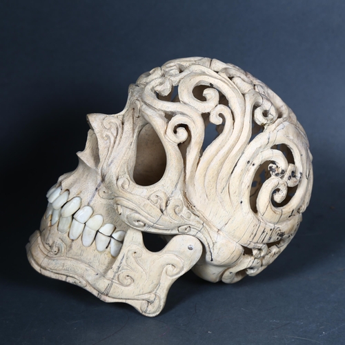 133 - Curiosity / Macabre - a Skull hand carved from Tamarind wood with buffalo bone teeth. A beautiful sk... 