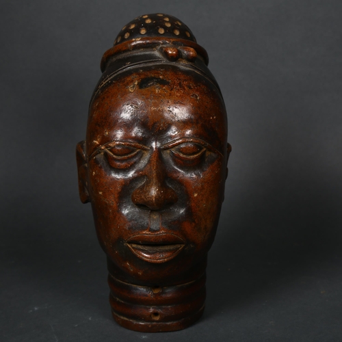 173 - An early 20th century Nigerian terracotta head, height 22cm.