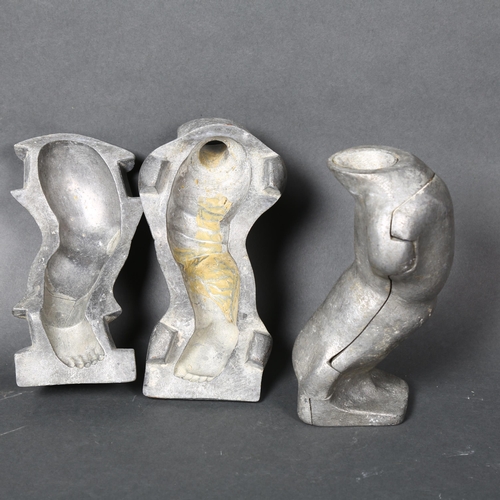 175 - A pair of vintage aluminium moulds for dolls legs, height 18.5cm, both mould are marked to the under... 