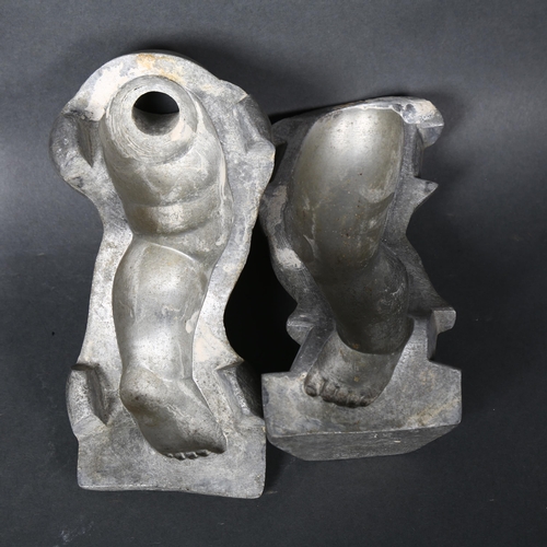 175 - A pair of vintage aluminium moulds for dolls legs, height 18.5cm, both mould are marked to the under... 