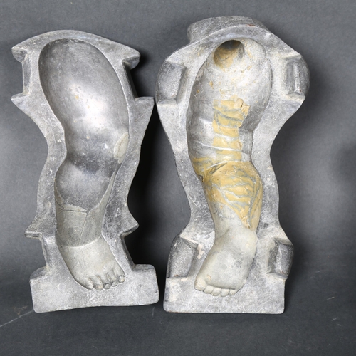 175 - A pair of vintage aluminium moulds for dolls legs, height 18.5cm, both mould are marked to the under... 