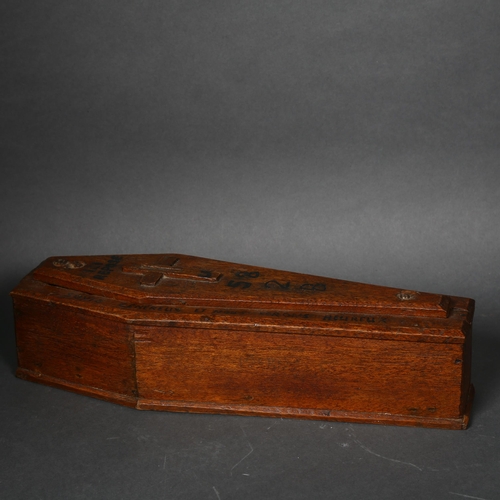 190 - An early 20th century apprentice piece coffin shaped oak money box, possibly French, with a painted ... 