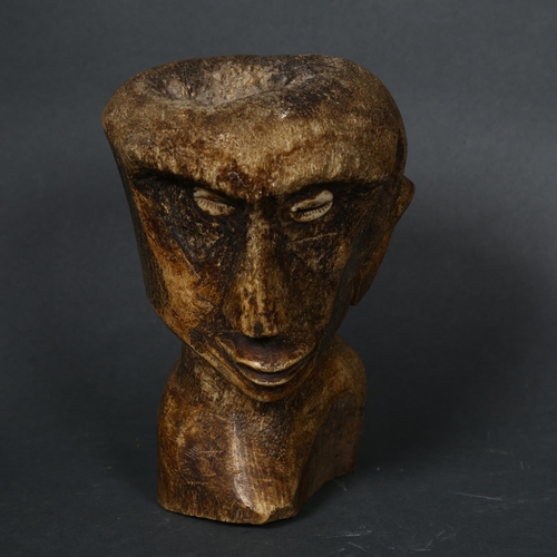 193 - A South Seas carved bone bust, with shell eyes, height 17cm.