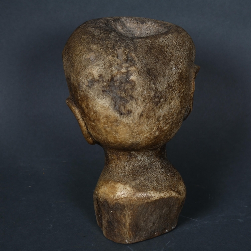 193 - A South Seas carved bone bust, with shell eyes, height 17cm.