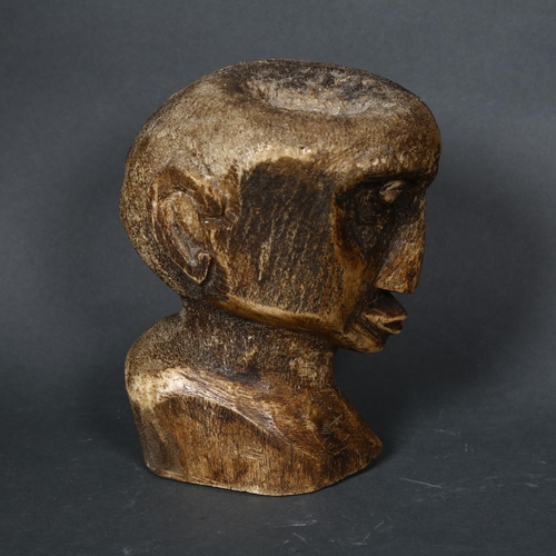 193 - A South Seas carved bone bust, with shell eyes, height 17cm.