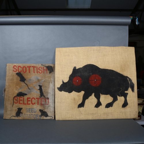 212 - A set of four vintage fairground targets from a shooting range, stencil spray painted on hessian sac... 