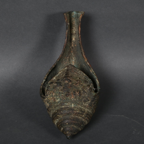 343 - A 12th or 13th century Khymer bronze libation vessel in the former of a conch shell, length 24cm.