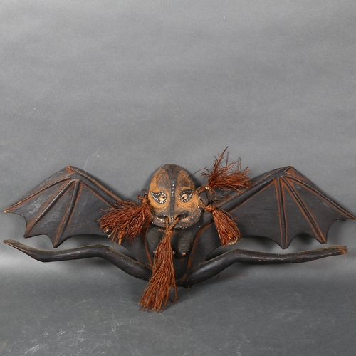 437 - A wooden Flying Fox sculpture by Joseph Kandibbo, Tambanum Village, Mid Sepik River, Papua New Guine... 