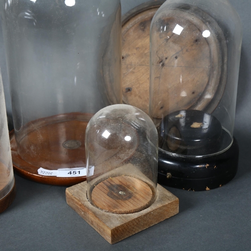 451 - A group of various vintage an other glass domes, some with associated stands, additional spare woode... 